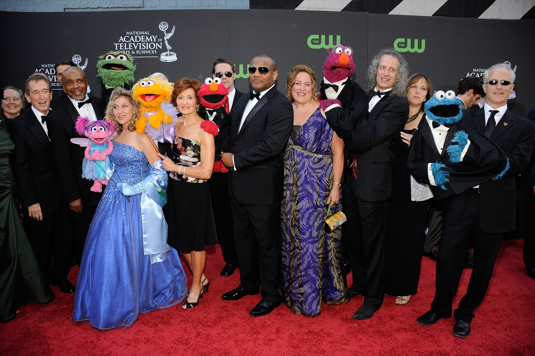 Kevin Clash and fellow performers with puppet characters at an awards event